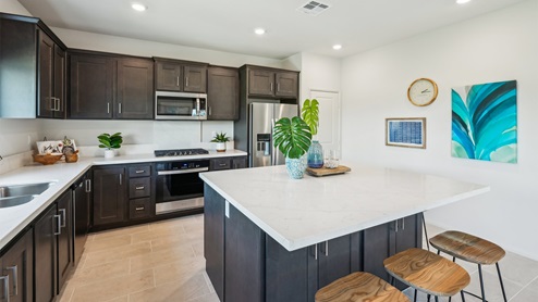 Kitchen peninsula with stainless steel appliances