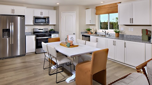 Open-concept kitchen with stainless steel appliances