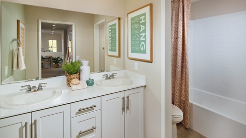 Bathroom with double sinks, shower and tub
