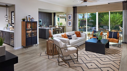 Great room with back patio door, and dining room view