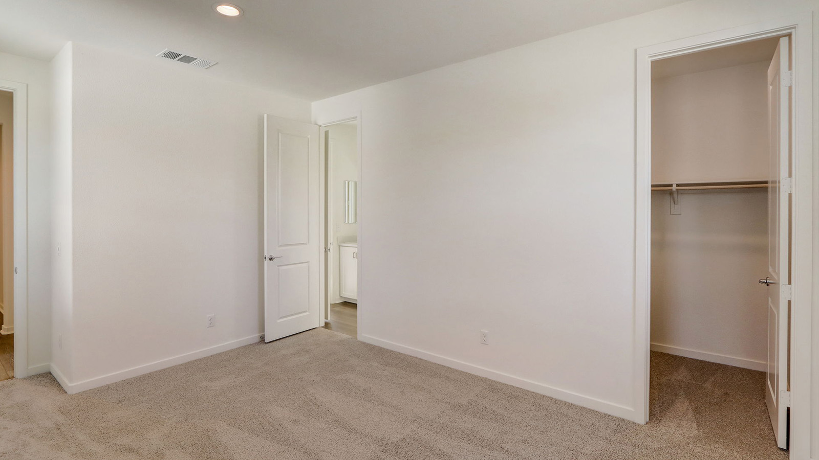 Secondary bedroom with carpet