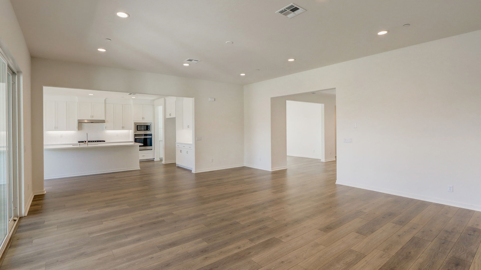 Spacious open-concept great room, dining room and kitchen