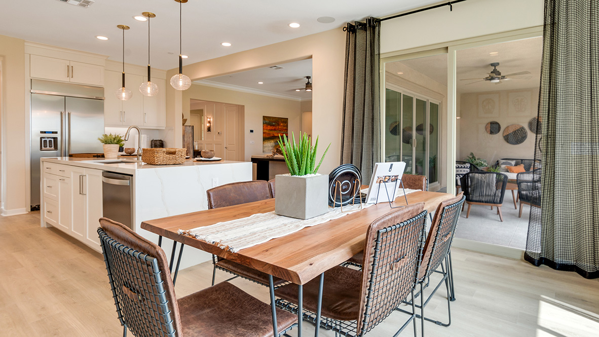 Kitchen with white cabinets and nook area