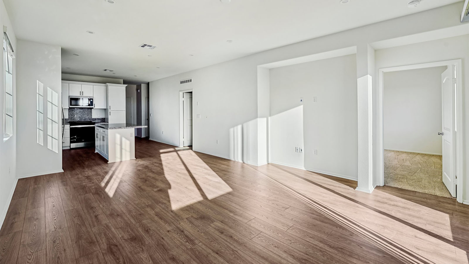 Great room with laminate wood flooring