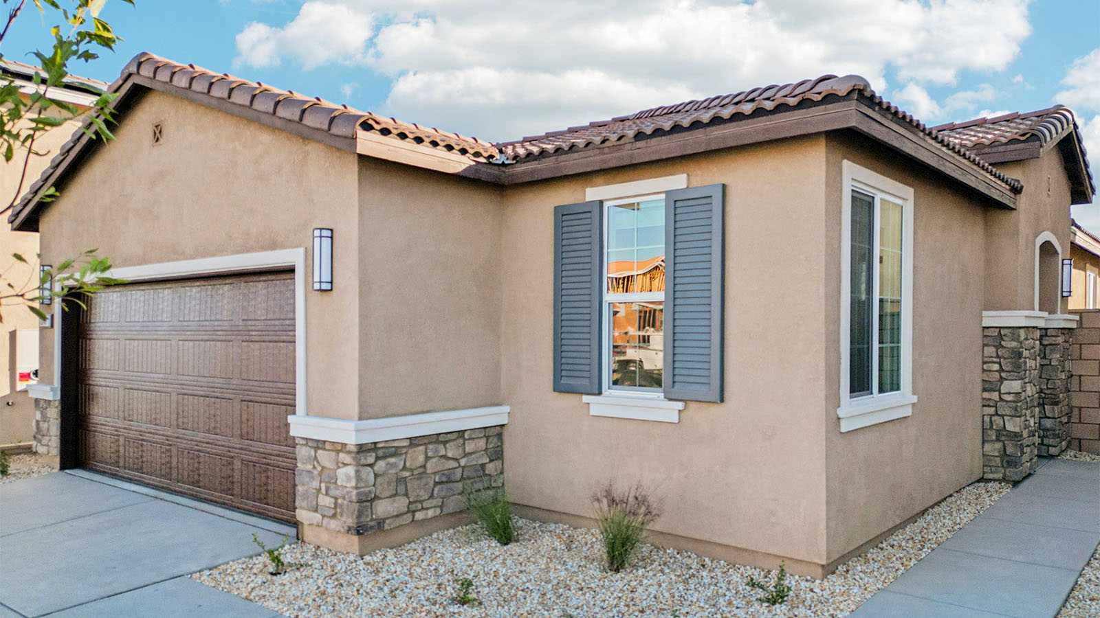 Two-story Tuscan home and two-car garage