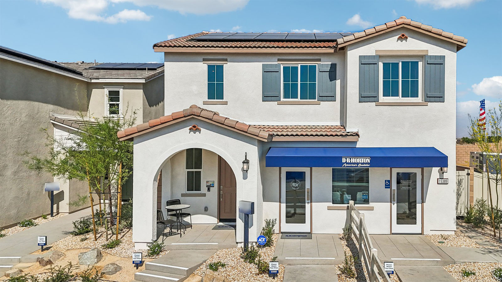 Two-story Spanish home and two-car garage