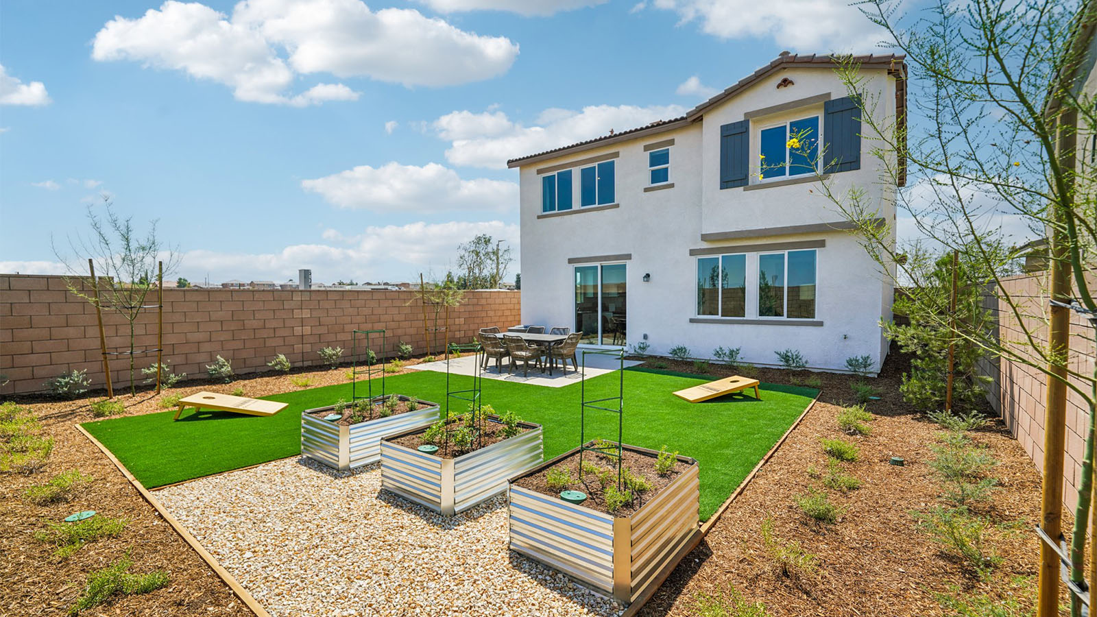 Spacious backyard with patio area and outdoor furniture