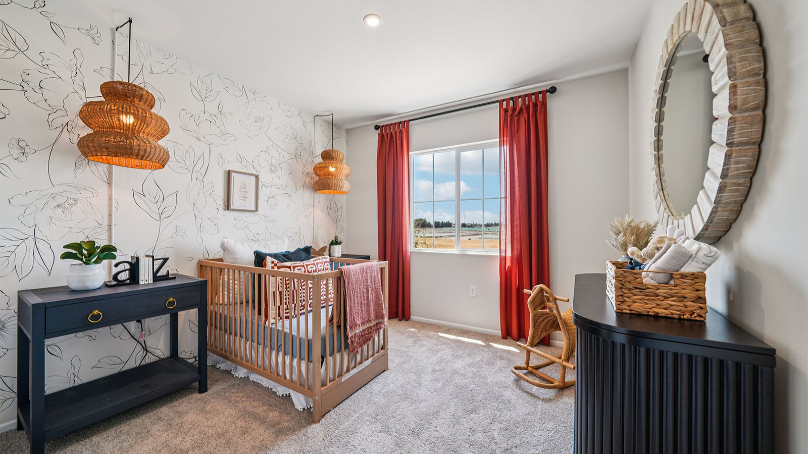 Nursery with plush caret and wallpaper accent wall