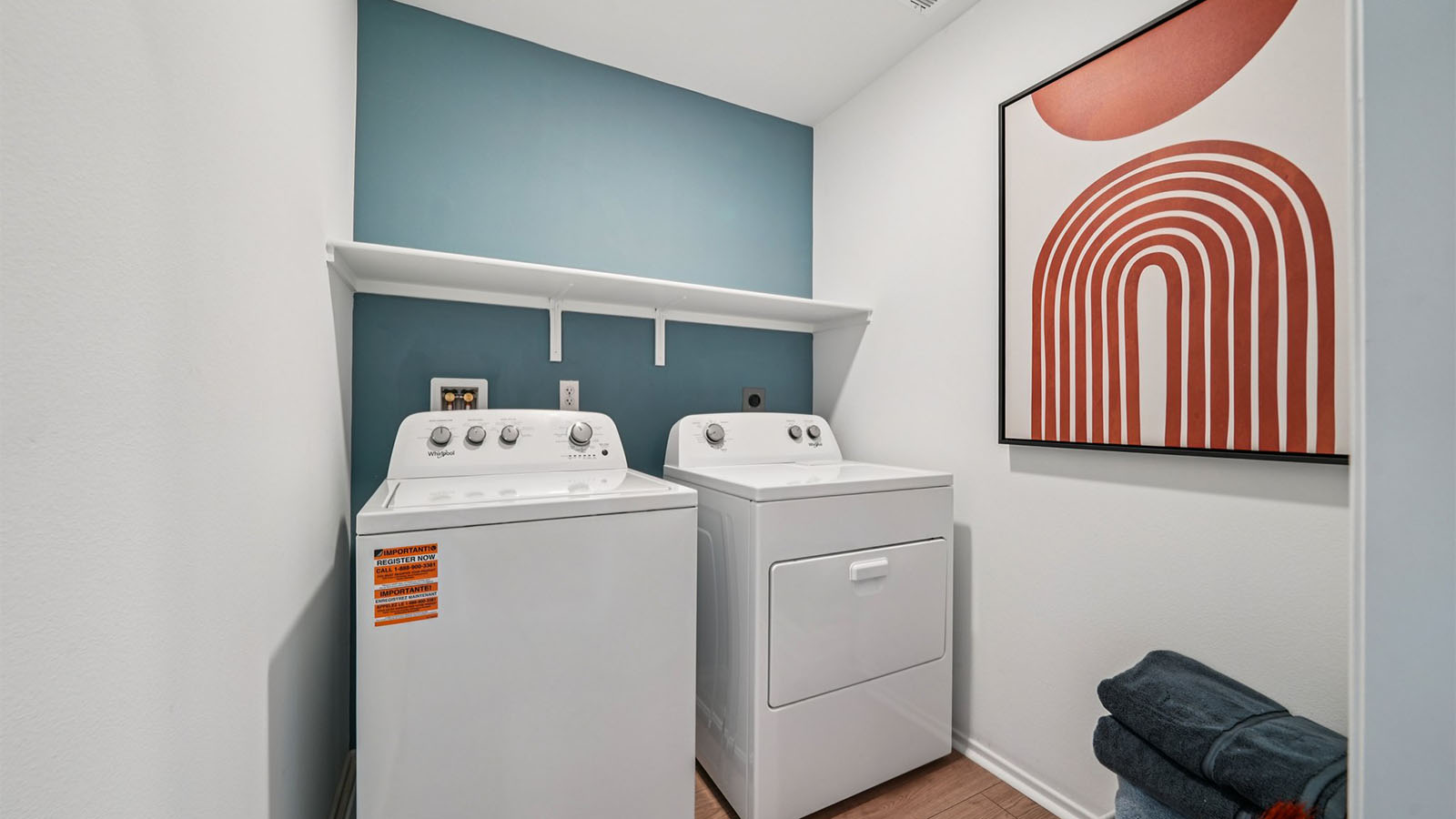 Laundry room with upper shelving