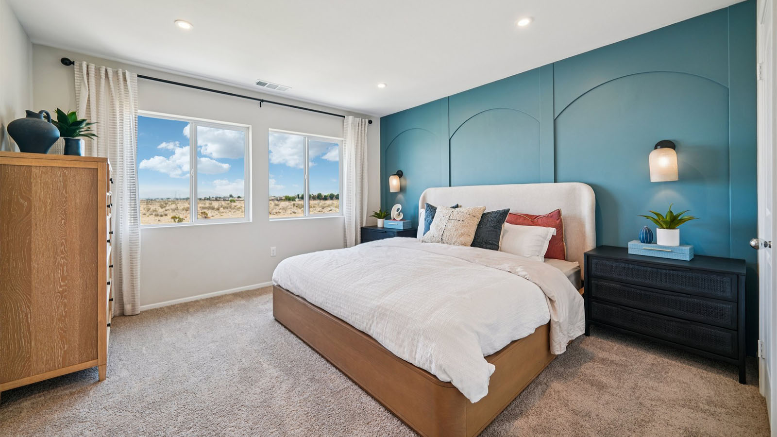 Primary bedroom with king bed with plush carpet