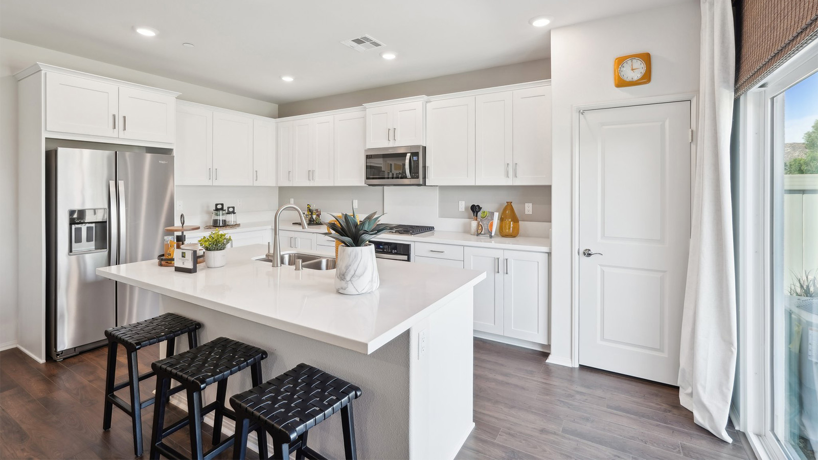 Kitchen peninsula with stainless steel appliances