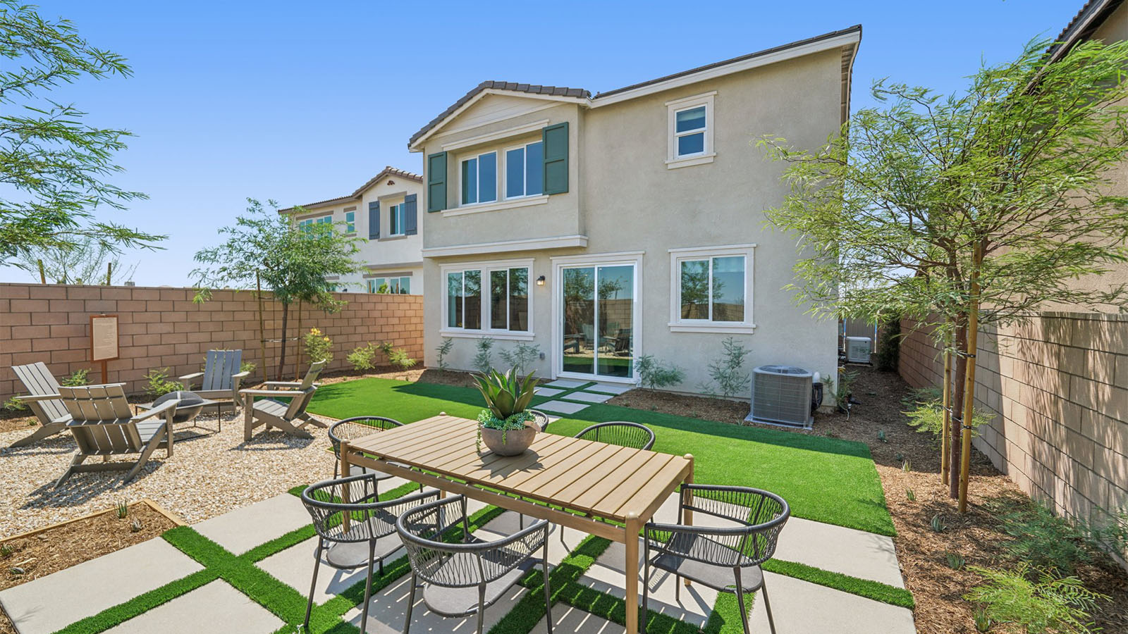 Spacious backyard with patio area and outdoor furniture