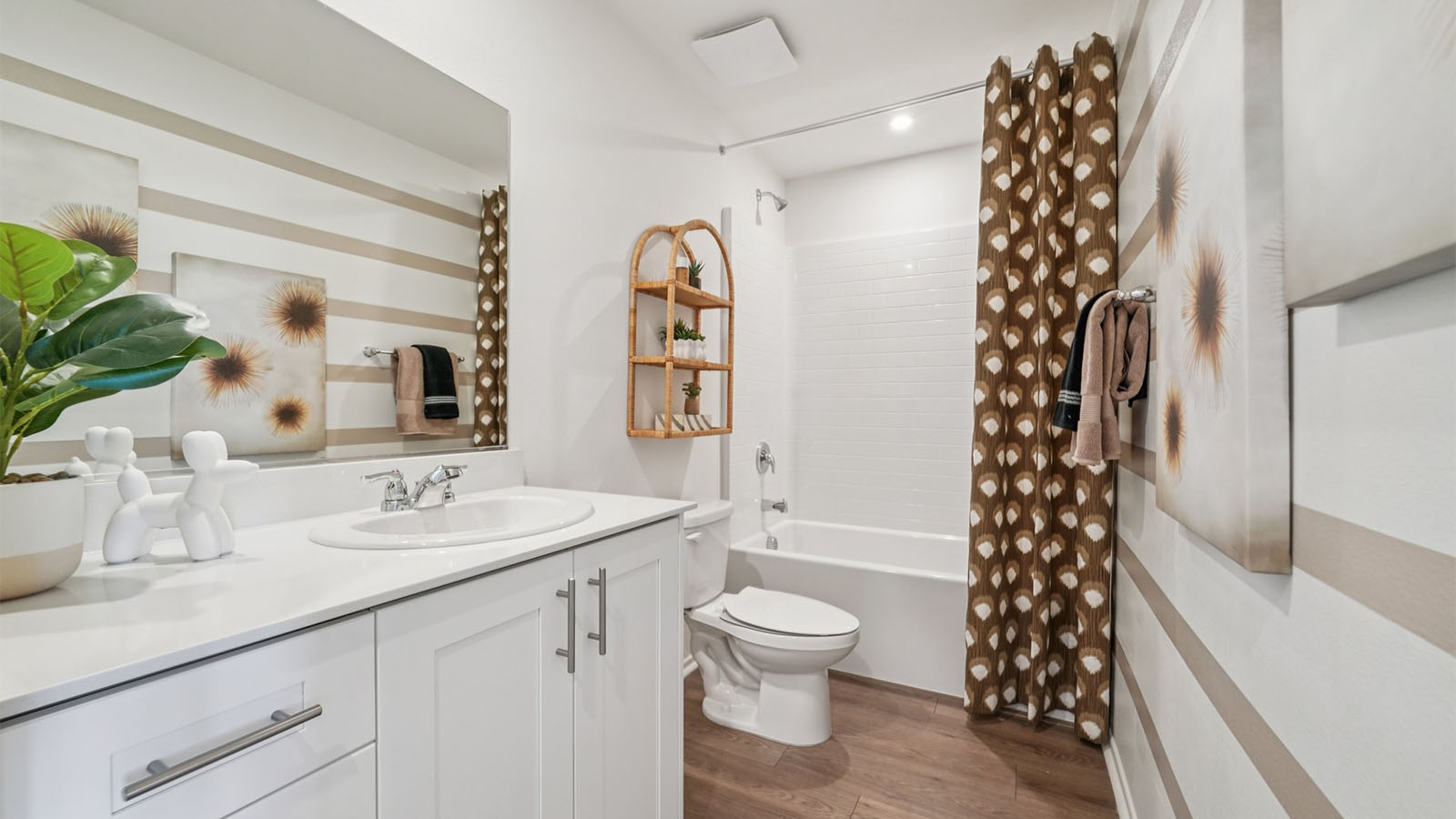 Bathroom with dual sinks and shower