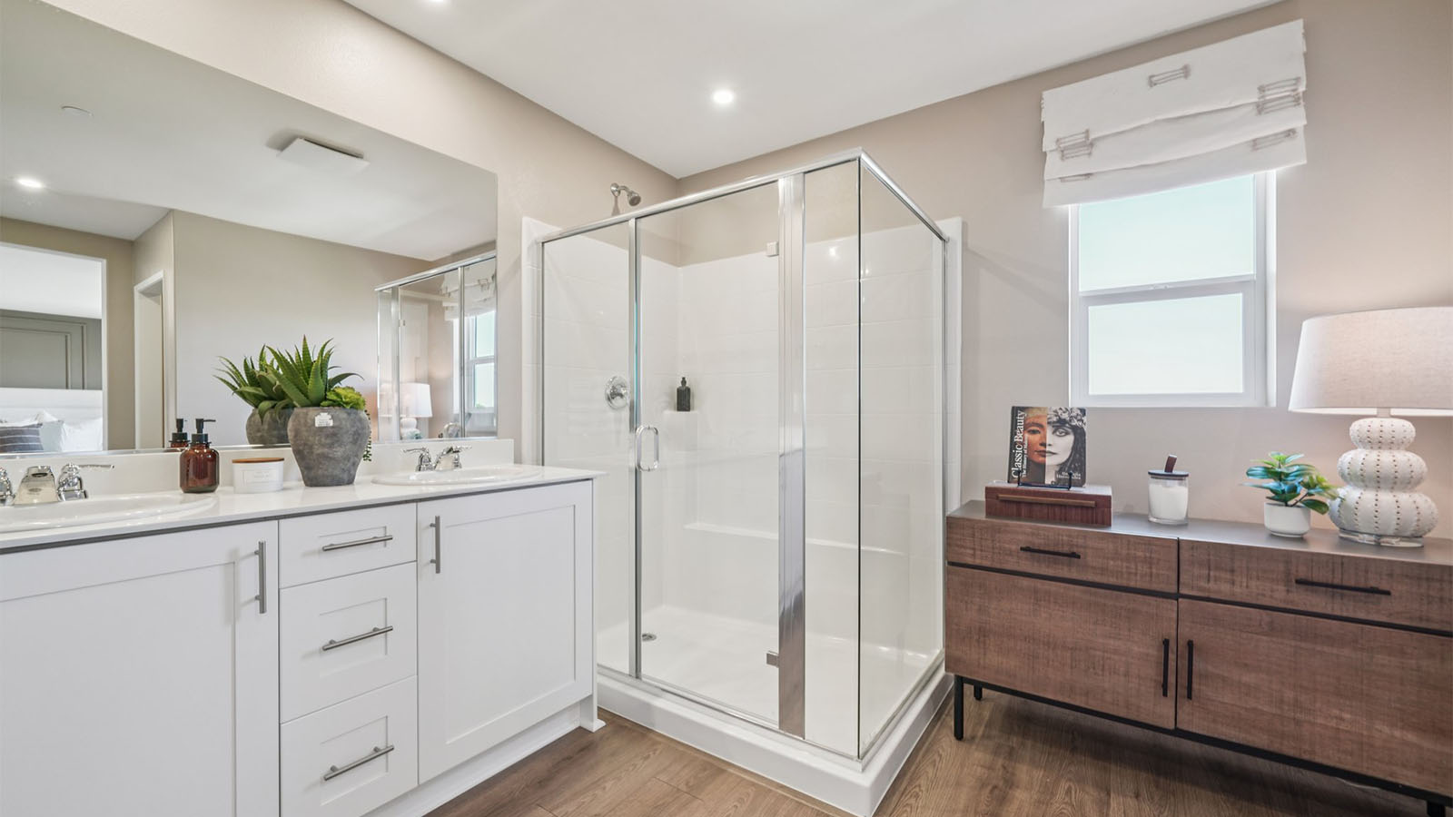 Primary bathroom with dual sink and shower