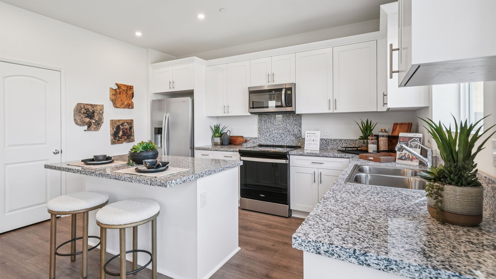 Modern open-concept kitchen area with granite countertops