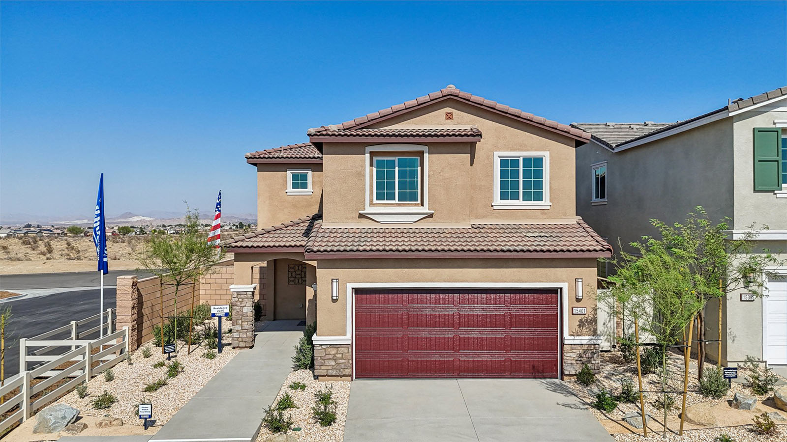 Two-story Tuscan home and two-car garage