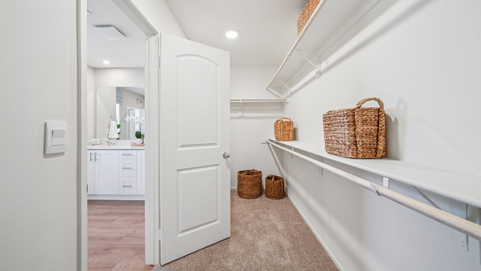 Primary bedroom walk-in closet