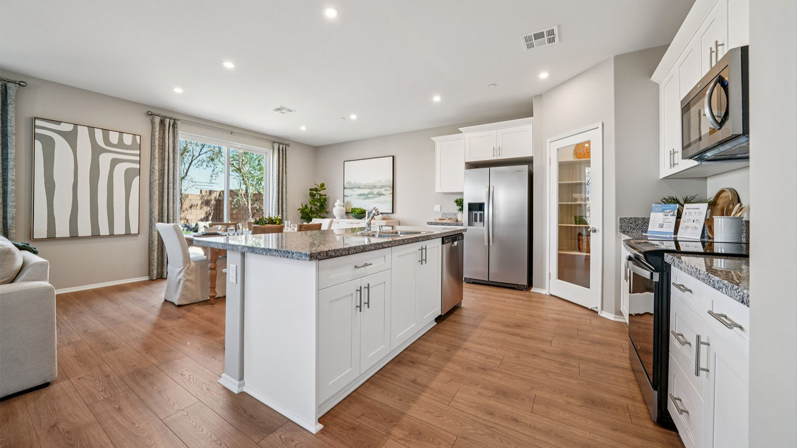 Spacious open-concept great room, dining room and kitchen