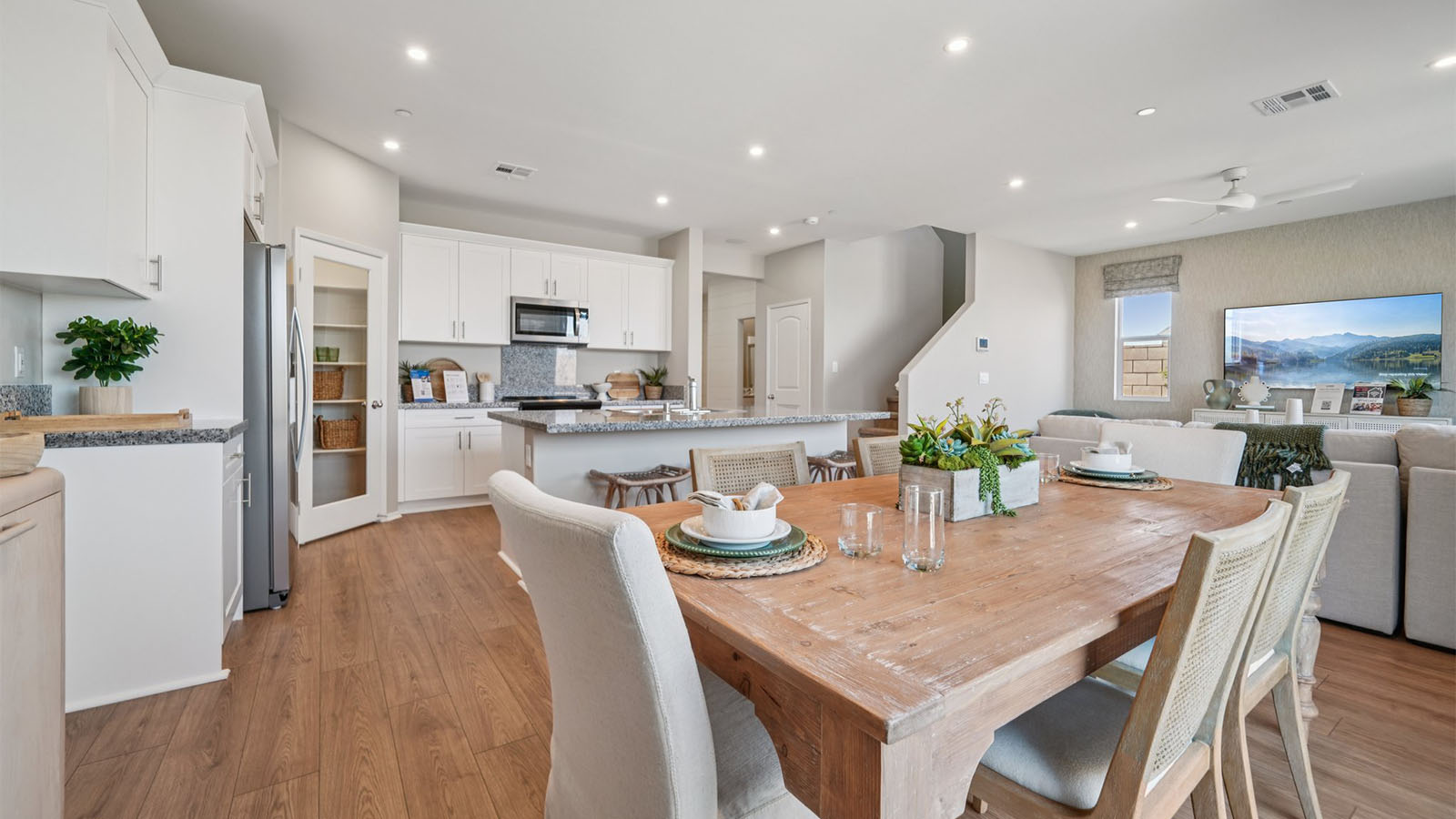 1Spacious open-concept great room, dining room and kitchen