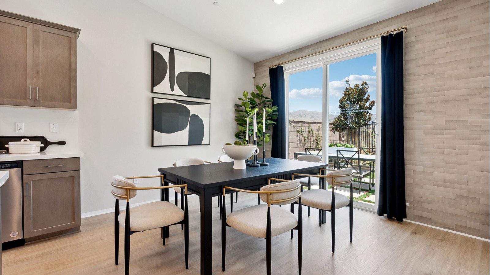 Dining space next to windows looking out into backyard