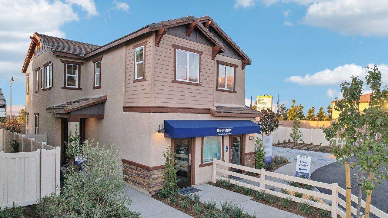 Two-story Craftsman home with stone veneer and two-car garage