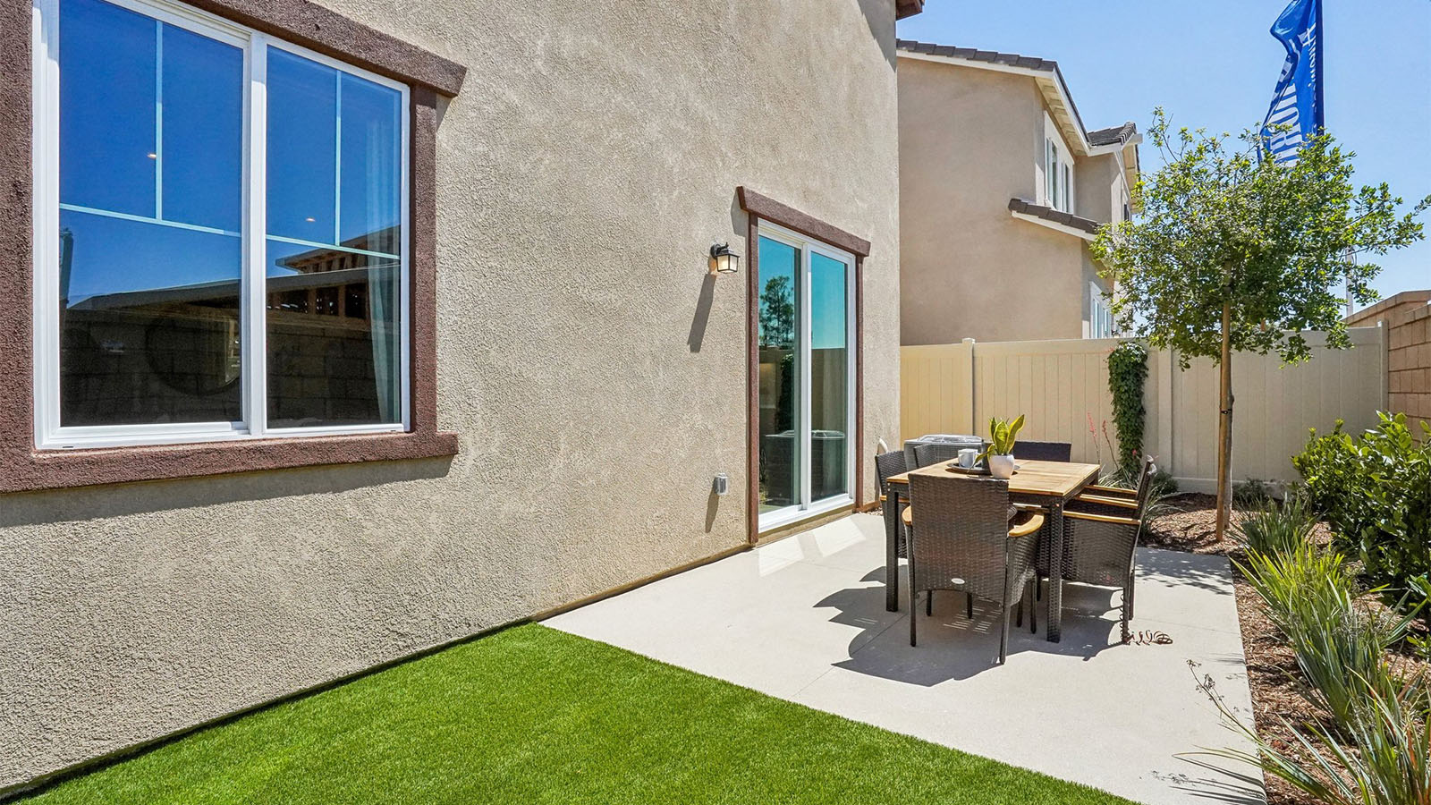 Backyard with turf and patio area