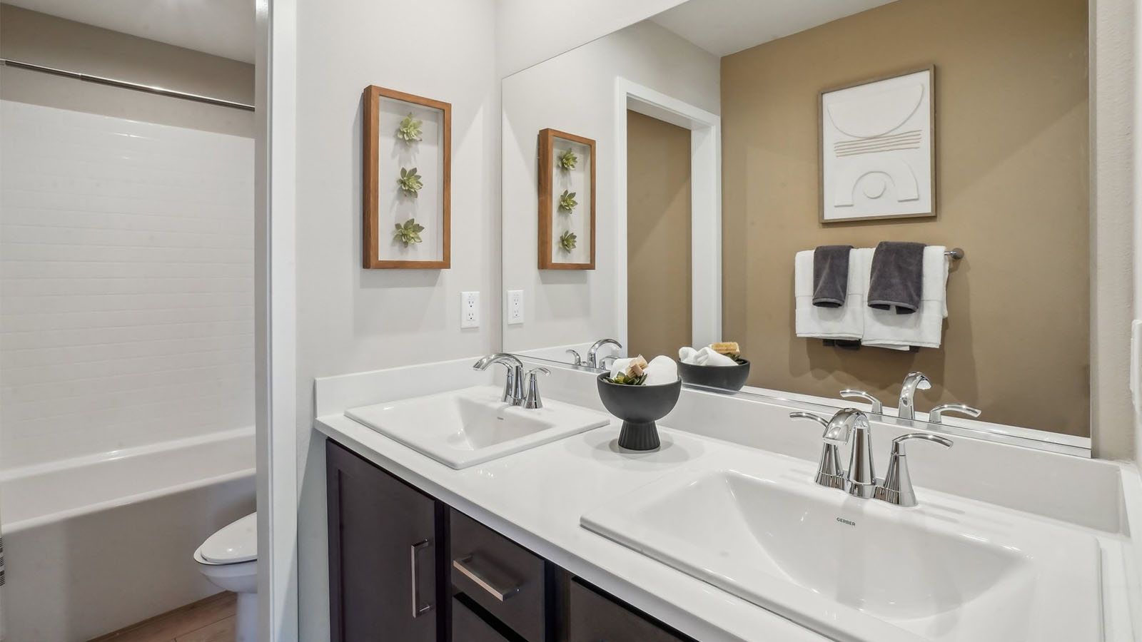 Secondary bathroom with vanity and tub shower combination