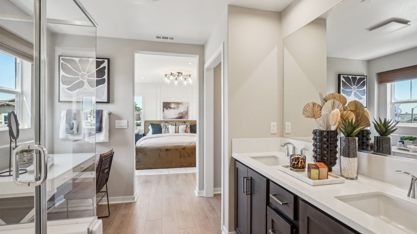 Primary bathroom with dual vanities and shower