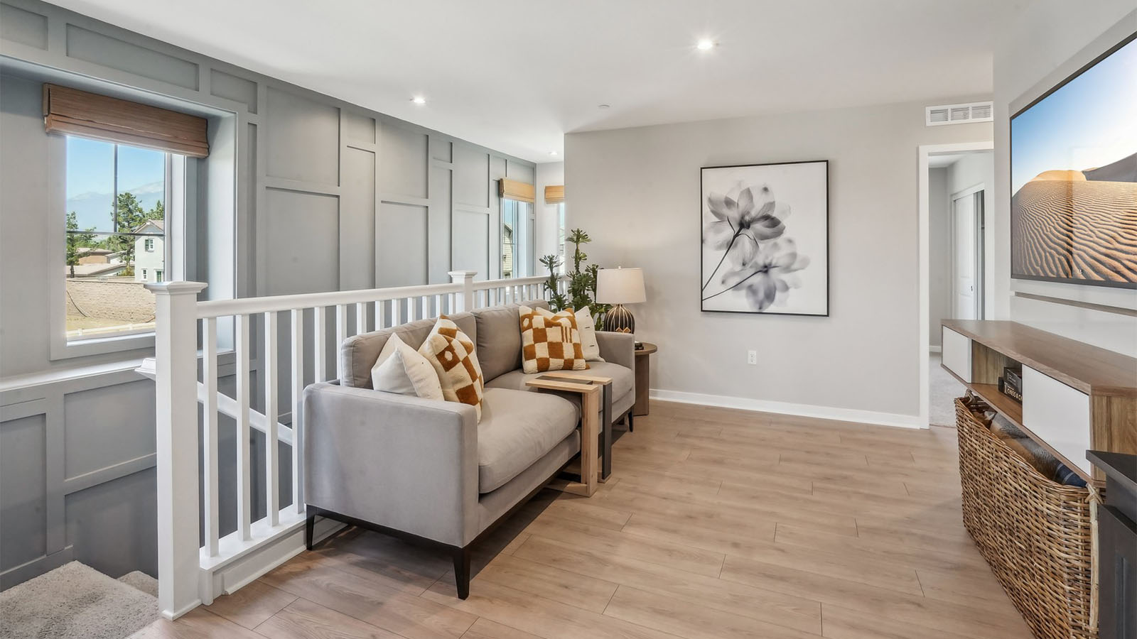 Loft with laminate flooring and open stairs