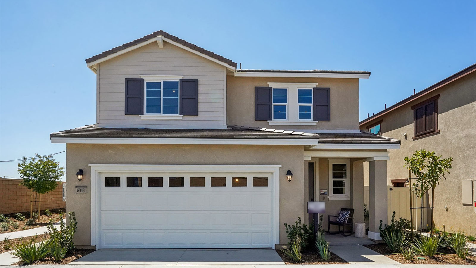 Two-story Traditional home with shutters and two car garage