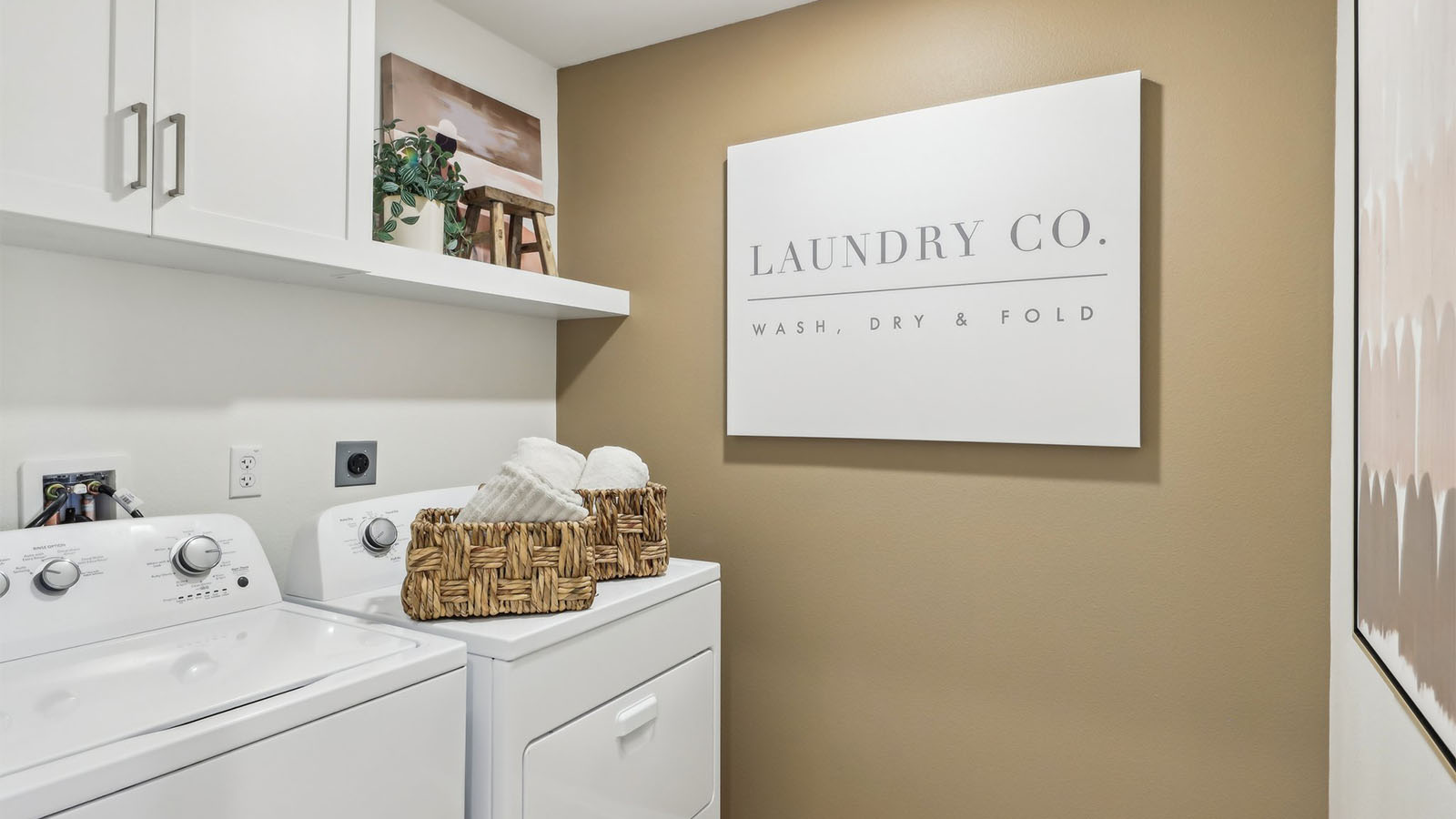 Laundry room with upper cabinet and shelve