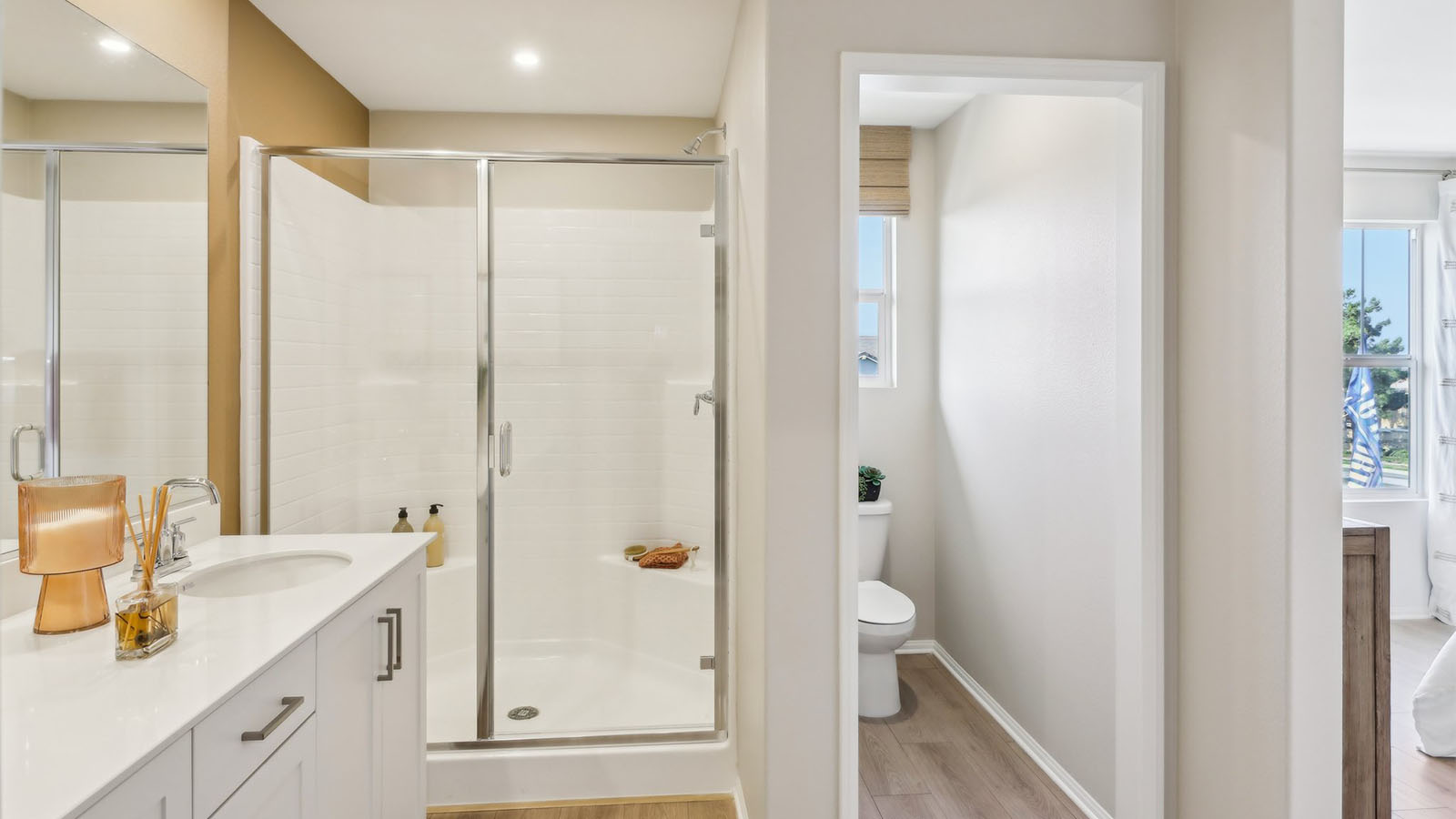 Bathroom with dual sinks and shower