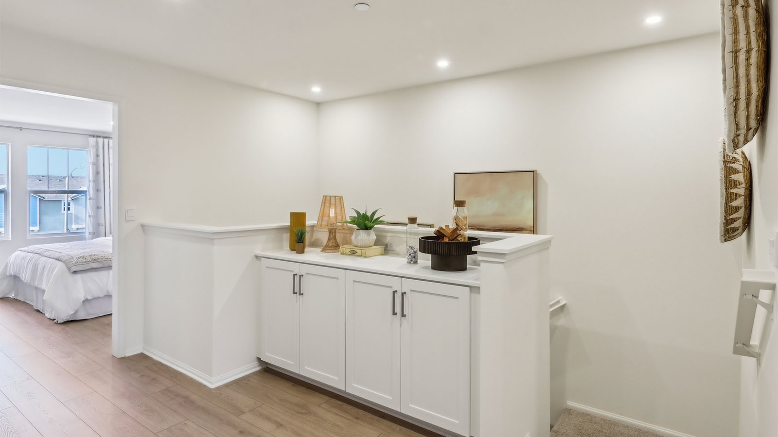 Spacious upstairs hallway with built-in cabinet