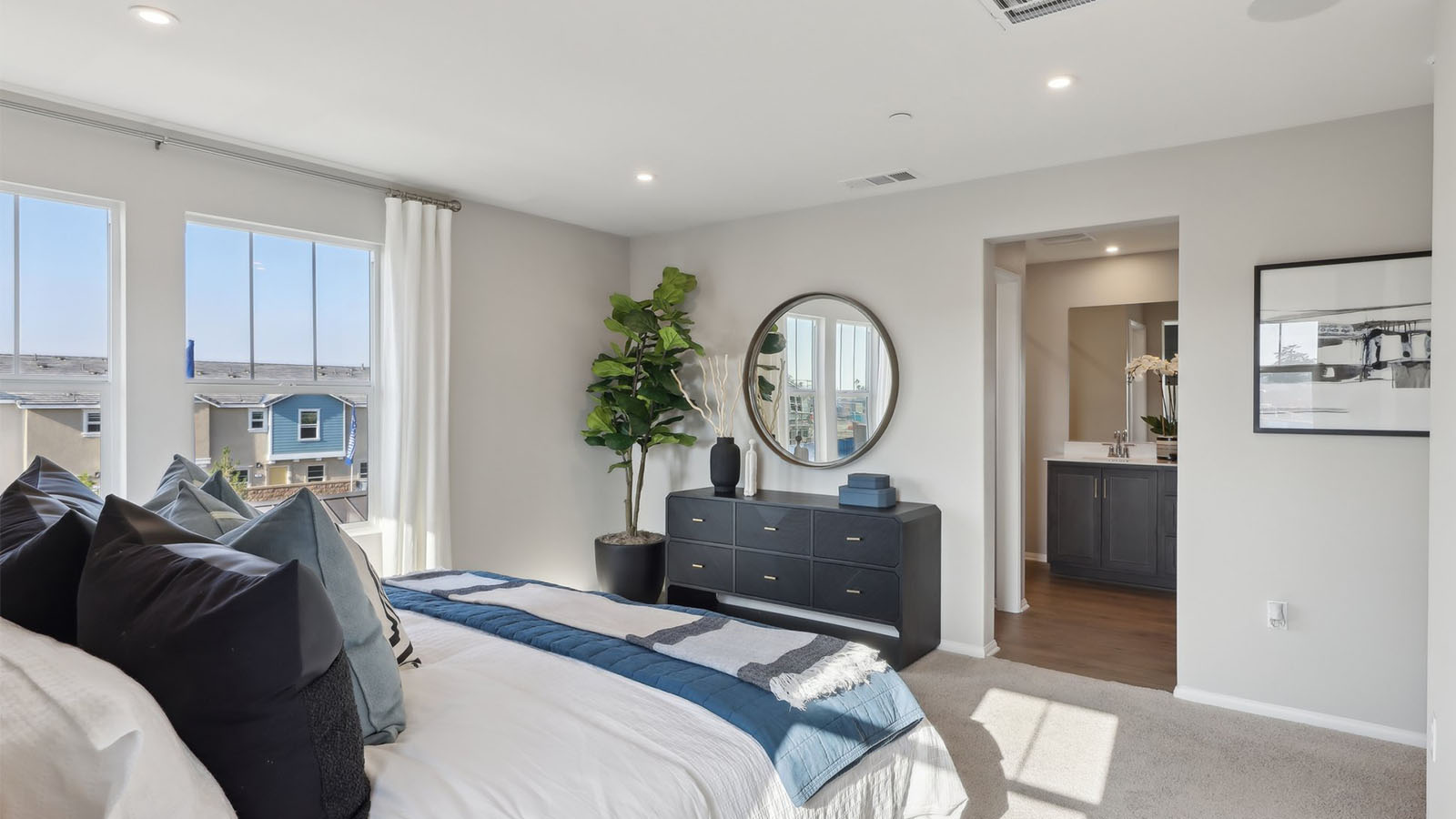 Primary bedroom with king bed and plus carpet