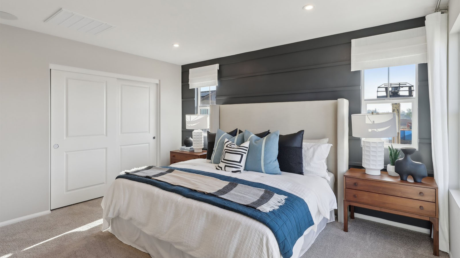 Primary bedroom with king bed and plus carpet