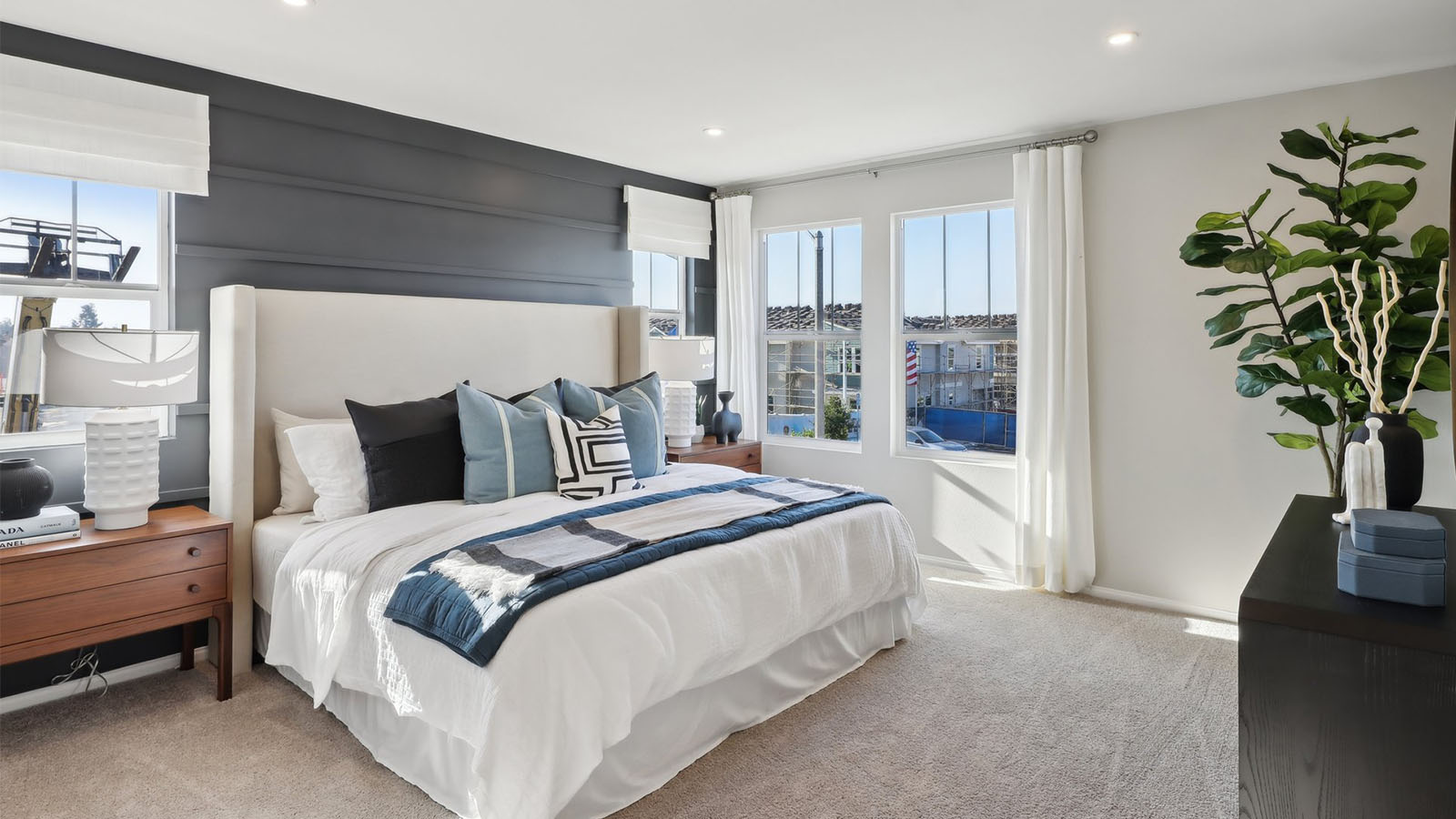 Primary bedroom with king bed and plus carpet