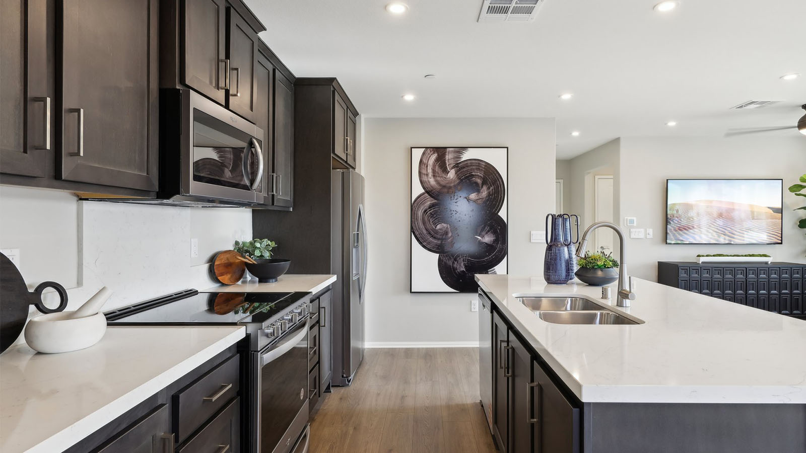 Open-concept kitchen with brown cabinets
