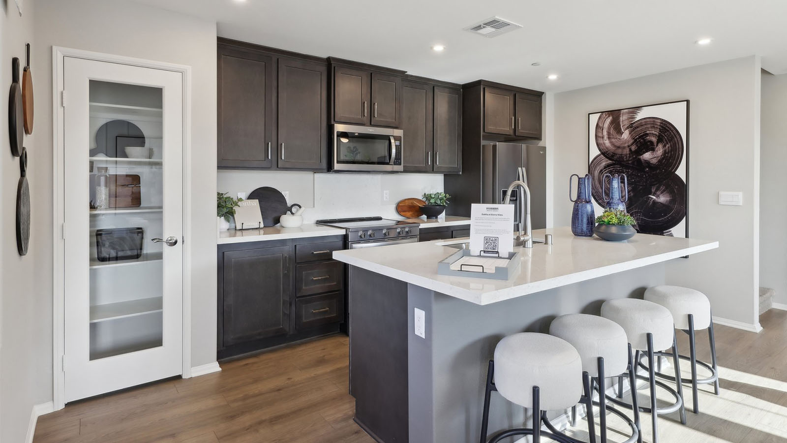 Open-concept kitchen with brown cabinets and island
