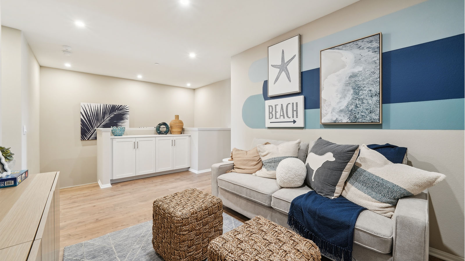 Spacious upstairs loft area with couches and tv