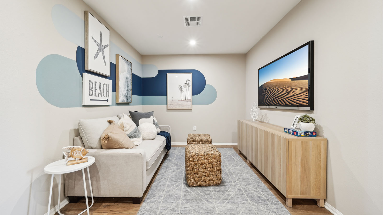 Spacious upstairs loft area with couches and tv