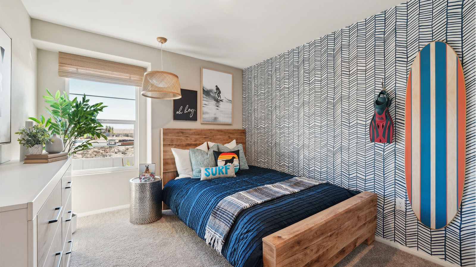 Bedroom with twin bed, accent wall, and plush carpet