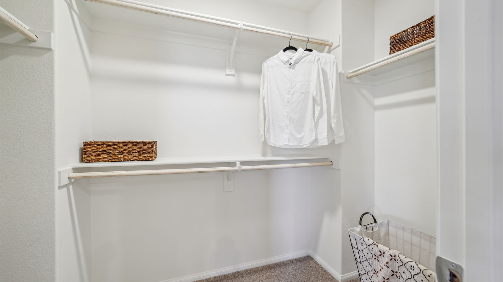 Spacious walk-in closet with plush carpet