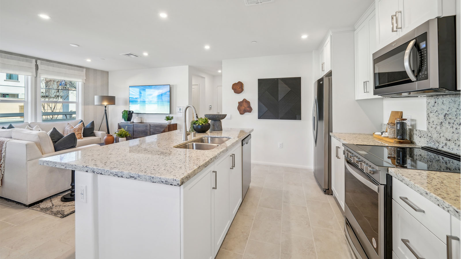 Open-concept kitchen with granite countertops and dining room