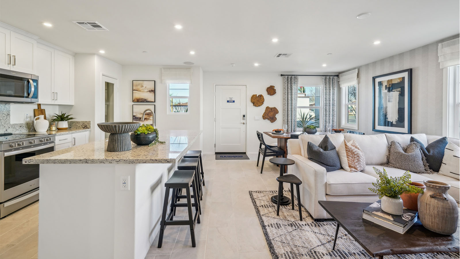 Open-concept kitchen with granite countertops and dining room