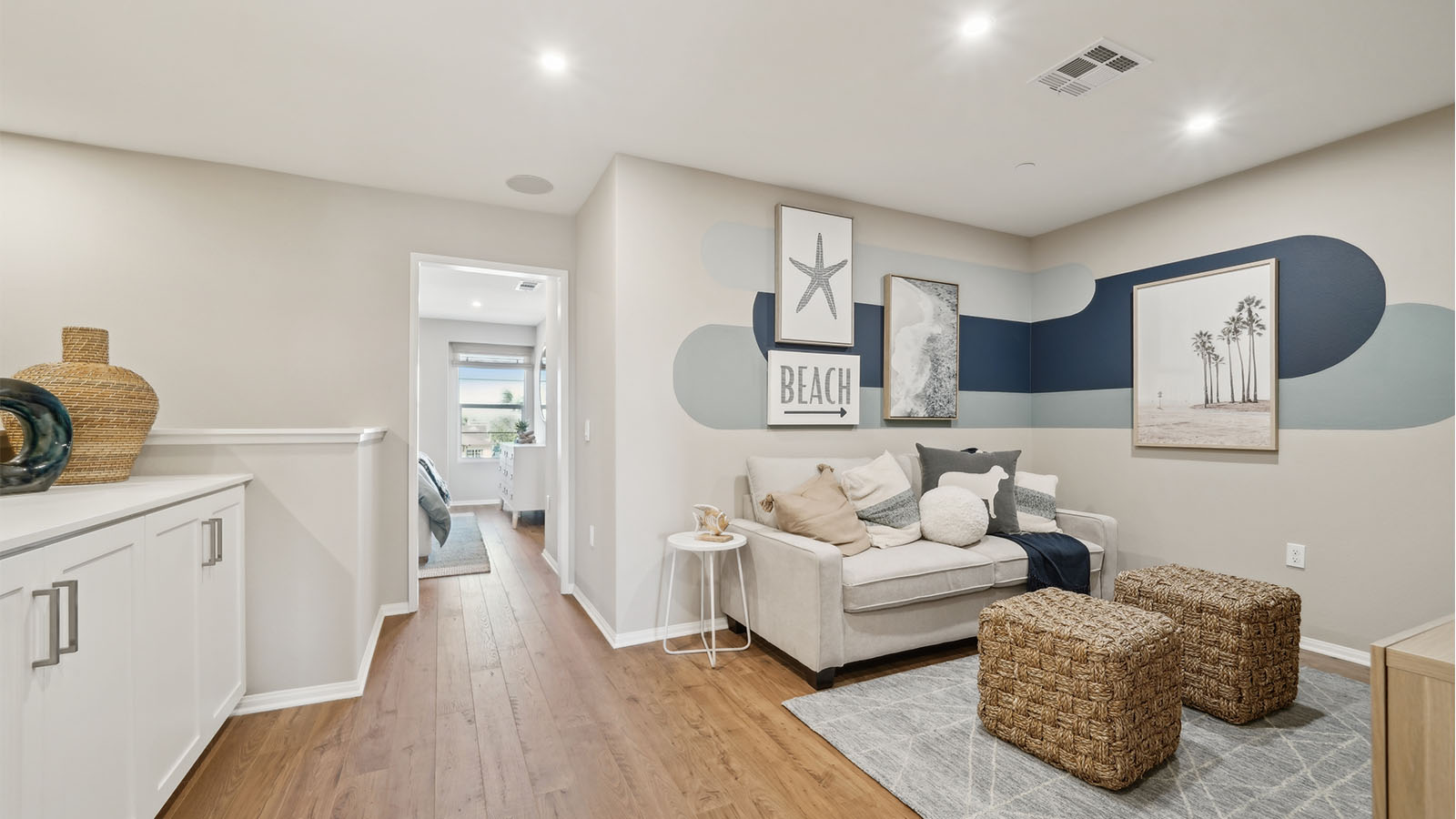 Spacious upstairs loft area with couches and tv