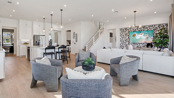 Interior living area open to staircase and kitchen
