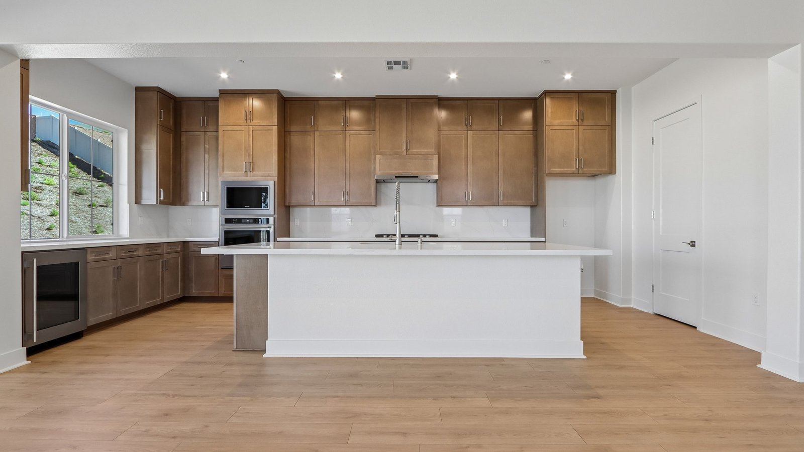 kitchen with brown cabinets and island