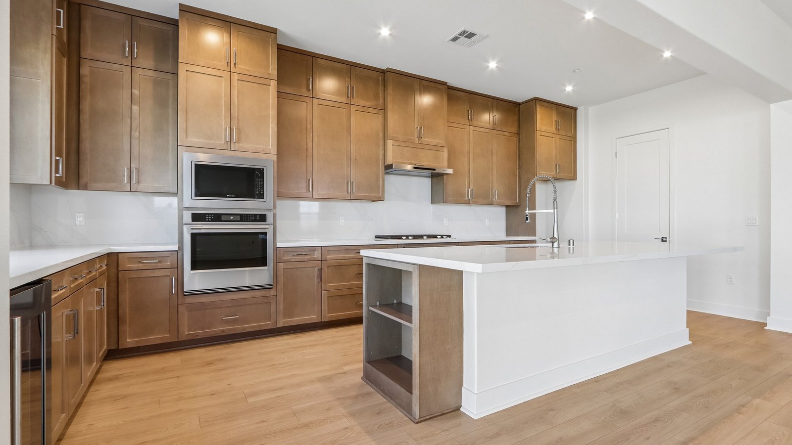 kitchen with brown cabinets and island