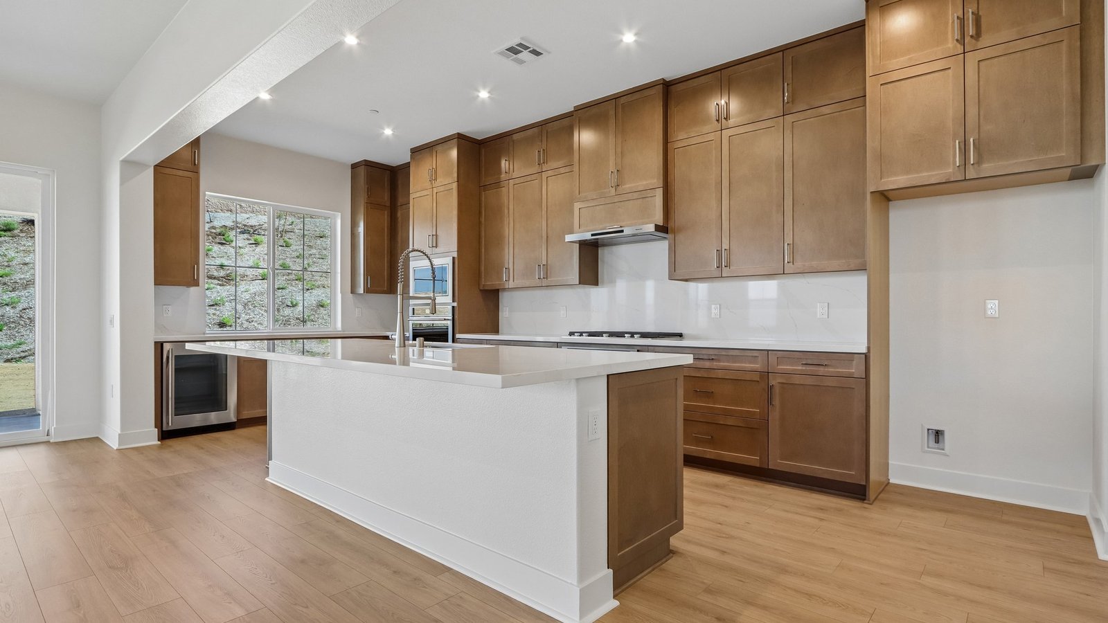 kitchen with brown cabinets and island