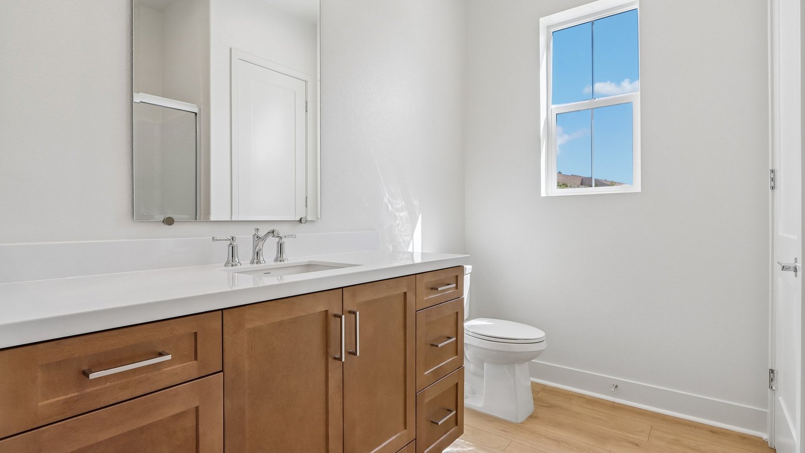 secondary bathroom with dual vanity